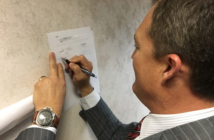 Lynch signs the trade agreement that sends the No. 2 pick to the Chicago Bears.